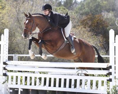 Gina Ross, winner of the 2,000 Junior/Amateur Owner Hunter Classic, the Gabriel C Duque Perpetual Trophy for high point amateur rider, and the Two Jacks Memorial Perpetual Trophy for overall high point rider of the show. Photo: Captured Moment Photography