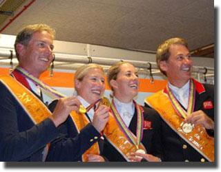 Gold winning British team, from left to right Carl Hester, Laura Bechtolsheimer, Carl's pupil Charlotte Dujardin and Emile Faurie
