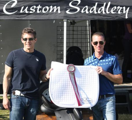 Cary Wallace (left) of Custom Saddlery presents Justin Hardin with the Custom MVR Award at the WEF Dressage Classic CDI-3*