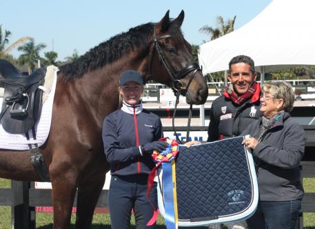 Nadine Burberl (left) with her mount Borett and trainer Dr. Cesar Parra receiving the Horse of Course High Score Award from Beth Haist of the Horse of Course.