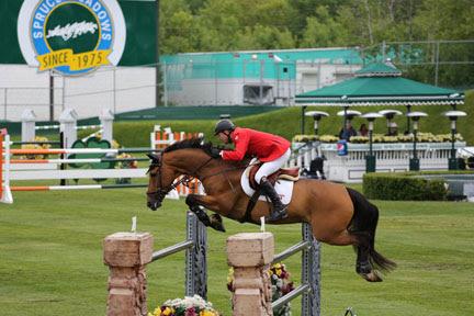 Ian Millar and guided Dixson to a second round clear in the 5,000 Furusiyya FEI Nations' Cup held Friday night, June 13, at the Spruce Meadows 'Continental' tournament in Calgary, AB. Photo Credit - Cansport