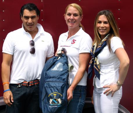 Juan Gonzalez (left) and Dr. Jennine Cabanellas (right) present Melissa Taylor of Legacy Farms with the Wellington Wellness Institute’s Rider Wellness Award during the 2013 Adequan Global Dressage Festival 5* CDI.