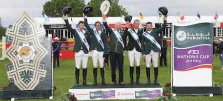 The Irish team celebrates their victory on the podium. Photos ©Spruce Meadows Media Services.