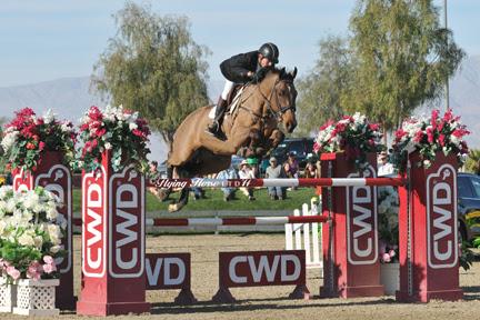 John Pearce and Son of a Gun on their way to a win in the ,000 Go Rentals Grand Prix, presented by Zoetis, at HITS Thermal. ©Flying Horse Photography