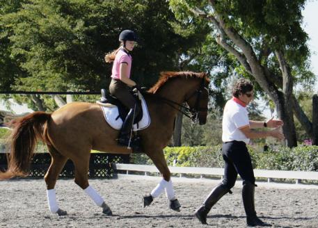 Molly Maloney riding Flyboy, owned by trainer Wes Dunham, with Juan Manuel Munoz