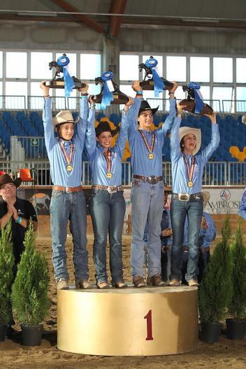 The Italian team of Enrico Sciulli, Linda Rebecca Martinelli, Maddalena Esti and Carlo Ambrosini claimed the Junior Team title at the FEI European Reining Championships for Juniors and Young Riders 2013 in Manerbio, Italy.  Photo: FEI/Andrea Bonaga.