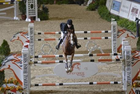 Katie Dinan and Nougat du Vallet complete a faultless run in the jump off round of the 0,000 Alltech Grand Prix.