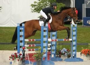 Kathryn Callaghan and Gentle Red jump to victory in the &dollar;1,500 Marshall &amp; Sterling Children's Jumper Classic on July 27 at the Vermont Summer Festival in East Dorset, Vermont. Photo by David Mullinix Photography