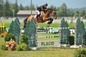 Kevin Babington rides Mark Q to victory in the 0,000 Woodlea Farms Grand Prix