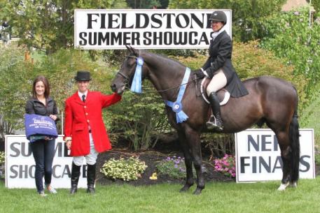 Kristen Bumpus and Inspired captured the ,000 NEHJA 2'9" Hunter Derby Finals at the Fieldstone Summer Showcase II. Photograph By: Kendall Bierer/PMG. 