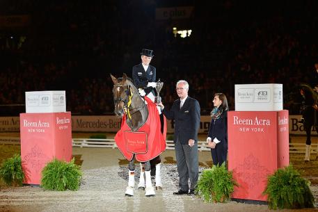 Photo Caption: FEI Director of Dressage, Trond Asmyr, presents the Reem Acra Trophy to Germany’s Helen Langehanenberg, winner of today’s third leg of the Reem Acra FEI World Cup™ Dressage 2012/2013 series at Stuttgart, Germany.  Photo: FEI/Karl-Heinz Freiler.