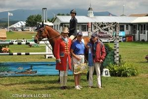 Laura Chapot after her win with ringmaster Alan Keeley and her Hall of Fame parents, Mary and Frank Chapot