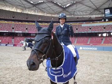 The copyright-free photo shows the winner of the Longines Beijing Masters 2013 Laura Kraut (Photo: Longines Beijing Equestrian Masters). 