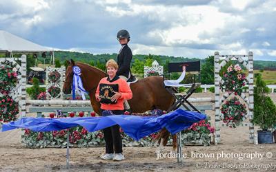 Madison Mitchell receives her HJAM Pony Medal Awards from Patricia Haines
