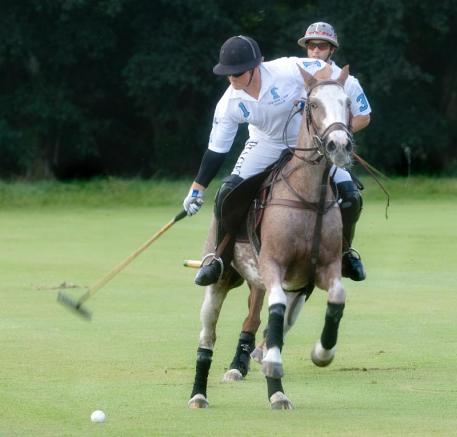 ELG's Marc Ganzi (1) takes the approach shot with teammate Carlitos Gracida (3) backing him up. Photo by Scott Fisher