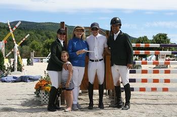 Mark Bluman celebrates topping the &dollar;10,000 Sir Ruly Open Jumper Awards at the 2013 Vermont Summer Festival with the Torano Family.  From left to right: Danielle Torano, Natalia Torano,Maria Teresa Torano, Mark Bluman, and Jimmy Torano. Photograph by David Mullnix Photography