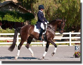 Mary Kehoe and Ascension in passage with a view of the Chardonnay barn