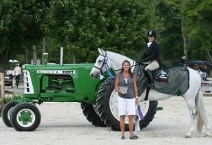 Marylisa Leffler, mounted on Zivago and joined by Vermont Summer Festival Awards Coordinator Jennifer Glass, is presented as the winner of the &dollar;5,000 NEHJA Hunter Derby on July 10 at the Vermont Summer Festival in East Dorset, VT. Photo by David Mullinix Photography