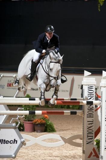 Two-time Olympic gold medalist McLain Ward jumps to victory in the 0,000 Alltech National Horse Show Grand Prix during the 2012 Alltech National Horse Show. 