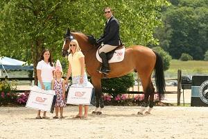 Michael Dorman (pictured on Valsinki S) are presented as the winner of the ,000 Vineyard Vines Welcome Stake, presented by Manchester Designer Outlets. Photo by David Mullinix Photography 
