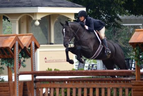 Molly McAdow and Barina, owned by Nina Donnelly, won both over fences and the under saddle in the 3' Pre-Green Hunters. Photo By: Brenda Mueller/PMG