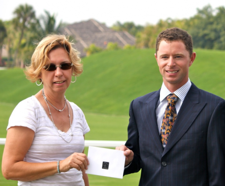 Nicholas Fyffe of Australia is presented with the ShowChic Turnout Award during the GDF Nations Cup CDI jog. Michele Hundt of ShowChic boutique sponsors the Turnout Award.