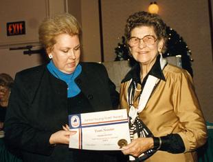 Judith Noone accepts USDF award for son Tom from Lazelle Knocke