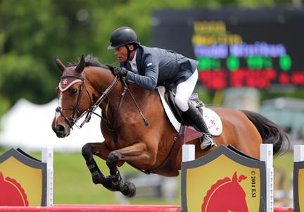 Todd Minikus and Quality Girl were the top pair in Friday’s ,000 SmartPak Grand Prix presented by Zoetis at HITS Saugerties. ©ESI Photography