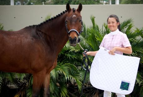 Natalie Pai and Charly received an embroidered saddle pad from Everglades Dressage for winning the Young Rider Achievement Award during the GCDA Finale I.  