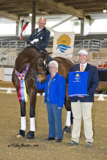 Steffen Peters and Legolas accept congratulations from judge Cara Whitham (5* CAN) and California Dressage Society President Kevin Reinig for the Grand Prix Special at the Mid-Winter Dressage Fair CDI-W. (Photo: Terri Miller)
