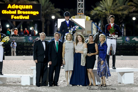 Adrienne Lyle in her winning podium presentation with Equestrian Sport Productions' Michael Stone, Allyn Mann of Adequan, Tuny and Charlotte Page of Stillpoint Farm, Cora Causemann of ESP, and President of the Ground Jury Anne Gribbons Photo: SusanJStickle