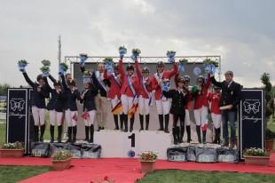 On the podium for the Young Riders Team Championship at the FEI European Jumping Championships for Children, Juniors and Young Riders 2014 at Arezzo, Italy: (L to R) the silver medallists from Norway, the gold medallists from Germany and the bronze medallists from Italy.  Photo: FEI/Stefano Secci.
