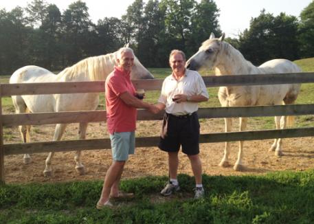 Ralph Graham of Hawk's Haven Farm and Keith Manfred of YS Nutrition celebrate the new sponsorship for Equine D a product bringing added value and quality of life to the retirees Ralph cares for on his farm in Glens Fork, Kentucky