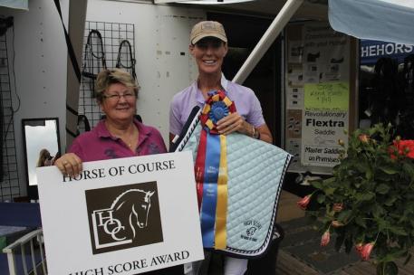 Beth Haist (left) presents Katarina Stumpf with the Horse of Course High Score Award.
