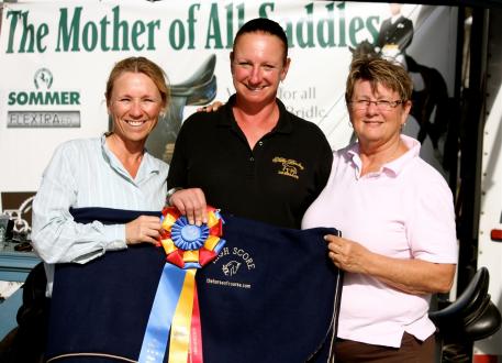 Left to right - Lori Raccioppo (owner) and Silke Rembacz (trainer) are presented with a beautiful cooler from The Horse of Course, presented to them by The Horse of Course owner Beth Haist, right.