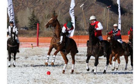 A bright red ball is used in snow polo to make it more visible on snow.