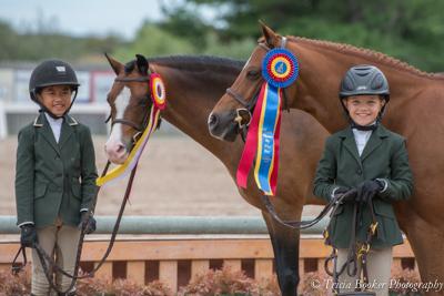 Sophie Gochman and Hi Lite, right, and Mimi Gochman and Rafael shared tricolor honors in the Small Pony Hunter section