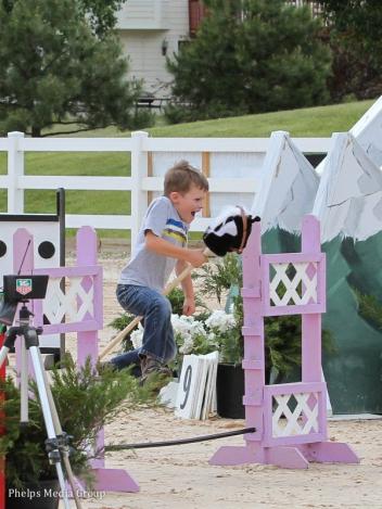 An enthusiastic participant in the stick horse race - Photo by Lauren Buettner