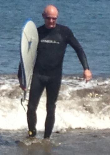 Jason Canton emerging from the surf near Santa Cruz