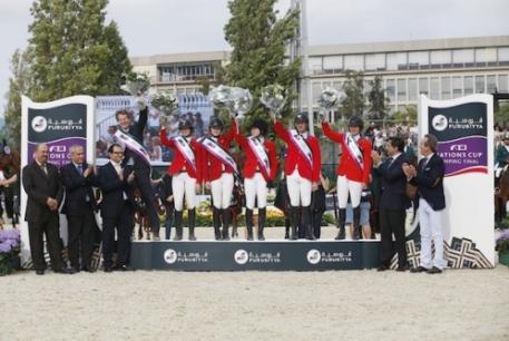 The winning USA team on the podium after the Consolation Class at the Furusiyya FEI Nations Cup™ Jumping Final at the Real Club de Polo in Barcelona, Spain today (from left) chef d'equipe Robert Ridland, Reed Kessler, Lucy Davis, Katie Dinan, McLain Ward and Beezie Madden with the presentation party of Abdul Rahman Al Hazza'a, President of the Saudi Broadcasting Corporation, Ingmar De Vos, FEI Secretary General, HH Prince Mansour Bin Khalid Alfarhan Al-Saud, Saudi Arabian Ambassador to Spain, (a
