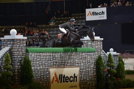  Tim Gredley and Unex Valente soar over a 7-foot LIFEFORCE Elite™ Puissance wall to claim their second win in the equestrian high jumping contest at the Alltech National Horse Show. Photo Credit: Tim Webb Photography for Alltech