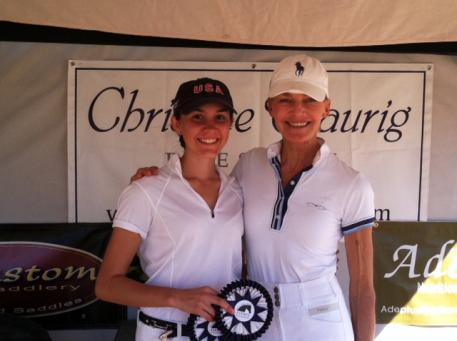 Ayden Uhlir and her trainer Christine Traurig celebrate a successful show.