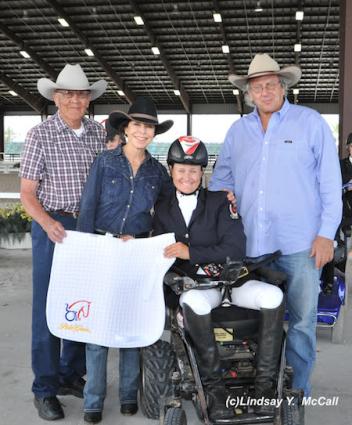 Lauren Barwick (CAN) Two -Time Paralympian, Grade II, at the Adequan Global Dressage Festival CPEDI3*. Barwick earned the high point award for Para-Dressage. Also pictured (Left to right) Newton Oldcrow, Jeanette Sassoon, and Gary Fellers of Polo Gear.