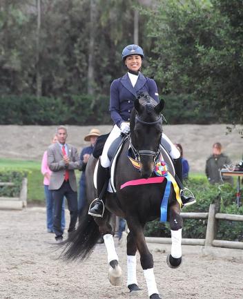 Anna Buffini and Sundayboy take their honors round winning the 2014 AGCO/USEF Young Rider Dressage National Championships Photo: Dr. George Kung