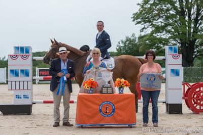 Happy Z and Wilhelm Genn receive their award from, left to right, course designer Michel Vaillancourt, show manager Alex Rheinheimer and sponsor Patrice Schreiber