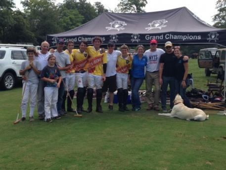  It takes a team effort, from left to right, Bob Daniels and his two young sons; pro player Tomas Goti, Justin Daniels, Wes Finlayson, Juancito Bollini, Marc Ganzi, Grant Ganzi, Robin Sanchez, Coach John Gobin, Gavin and Jenni Guinan.