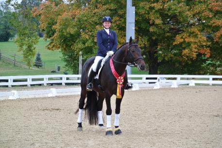 Kate Poulin and 7-year-old Count Sinclair (Lord Sinclair), owned by Sally Gries, won the Reserve Championship in the 2014 Region 2 2nd Level Open. (Photo: Poulin Dressage)