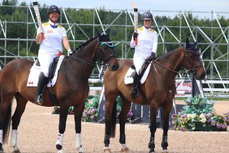  Omega Alpha Ambassador Jacqueline Brooks (left) prepares to carry the Pan Am Flame toward Toronto, Canada, for the 2015 Pan American Games (Photo: Omega Alpha)