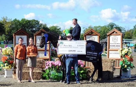 Lindsay Yandon and Asia Manning of HITS present top honors, including a Horseware Ireland cooler and 50,000 winner's check to Aaron Vale and Dress Balou. ©ESI Photography