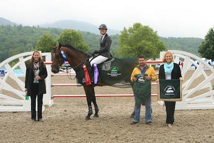 Following her win in the $30,000 Vermont Summer Special Grand Prix, presented by Johnson Horse Transportation, Amanda Flint (pictured on Child Z) and groom Marco Turcios, are honored by Jennifer Glass and Ruth Lacey of the Vermont Summer Festival. (Photo: David Mullinix Photography)